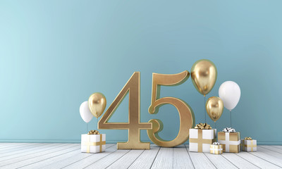 Number 45 party celebration room with gold and white balloons and gift boxes. 