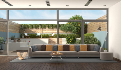 Living room of a modern villa with garden on background