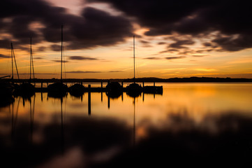 sunrise over sailboats