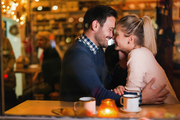 Young attractive couple on date in bar