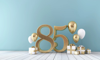 Number 85 party celebration room with gold and white balloons and gift boxes. 