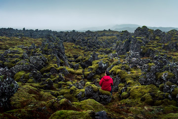 Man enjoying lava field view in Iceland