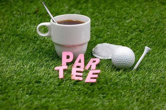Golf par tee with golf ball and tee on green grass