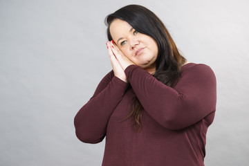 Woman being sleepy gesturing