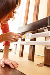 Person renovating wooden hanger