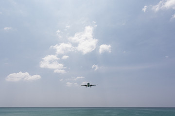 Airplane Landing over sea at Phuket Airport, Mai Khao beach phuket thailand