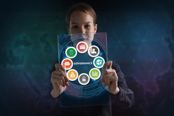 The concept of business, technology, the Internet and the network. A young entrepreneur working on a virtual screen of the future and sees the inscription: Governance
