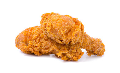 hot and crispy fried chicken legs isolated on a white background