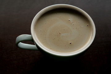 Cup of Espresso coffee on board background, cappuccino