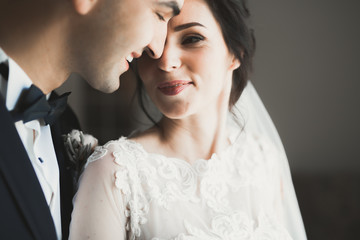Naklejka premium Sensual portrait of a young wedding couple. Outdoor