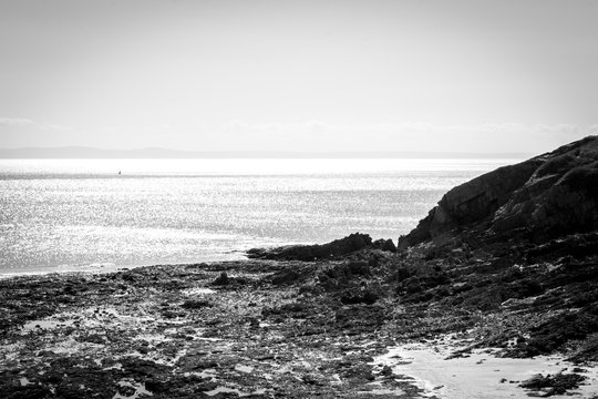 Dramatic rocky coastline in black and white