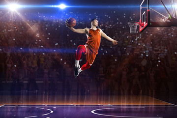 Basketball player in jump. around Arena with blue light spot