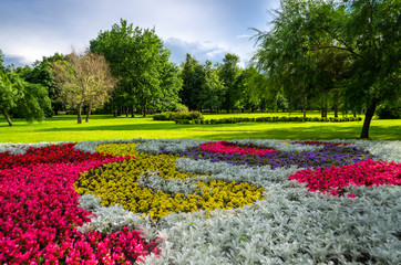 Plakat Beautiful open-air park with flower bed