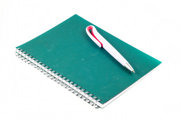 notebook with a pen on a white background