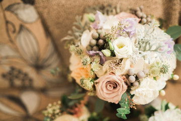 Beautiful wedding bouquet with different flowers, roses