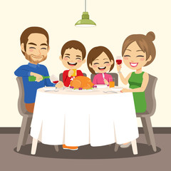 Happy family having dinner enjoying delicious roasted chicken sitting together on table
