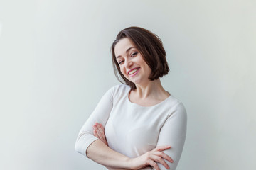 Happy girl smiling. Beauty portrait young happy positive laughing brunette woman on white...