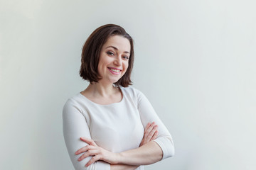 Happy girl smiling. Beauty portrait young happy positive laughing brunette woman on white...