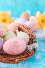 Easter background with Easter eggs and spring flowers. 