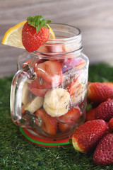 Fresh strawberry in glass jar