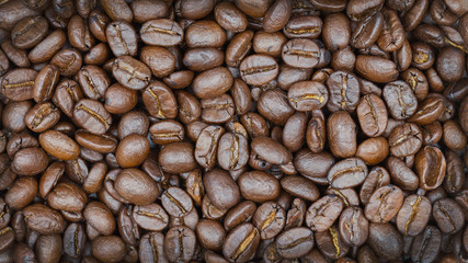 Brown roasted coffee beans texture background for food and drink or agriculture concept design