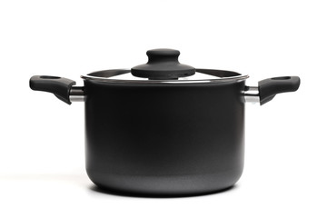 Open stainless steel cooking pot with lid over white background