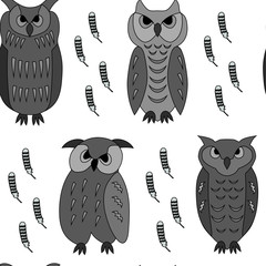 seamless pattern of black and white owls and feathers