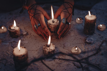 woman hands holding candle close up