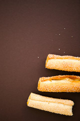 Cookies on the chocolate (dark brown) background