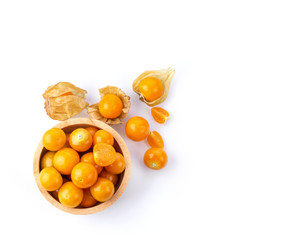 Cape Gooseberry in wood bowl isolated on white background. top view