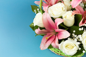 Closeup beautiful flowers in pastel colors on a blue background. Greeting card, Mom's day, wedding invitation, birthday .Copy space.