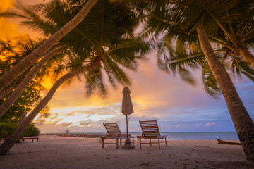 Beautiful beach. Chairs on the sandy beach near the sea. Summer holiday and vacation concept for tourism. Inspirational tropical landscape