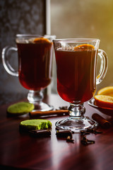 Mulled Wine with pistachio cookies, orange and dark chocolate