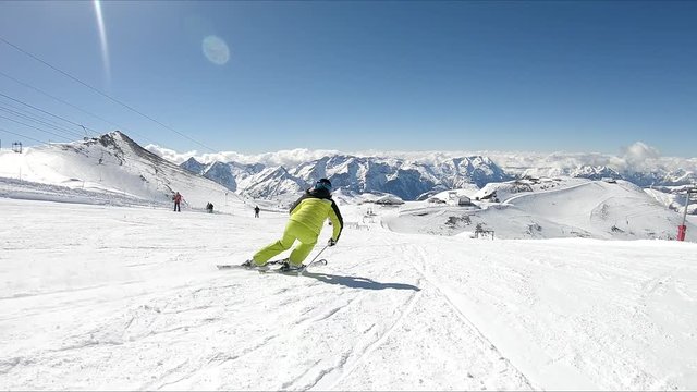 Female skier go down on ski route