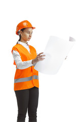 Destroying gender stereotypes. Female builder in orange helmet standing on white studio background. Safety specialist, engineer, occupation, businesswoman, job concept. Woman in the male profession