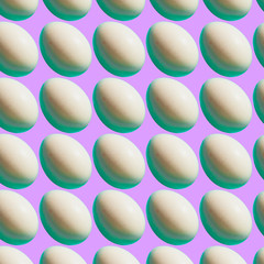 Pattern of white Easter eggs on purple or pink bright background.  Happy spring holidays concept. Minimalism.