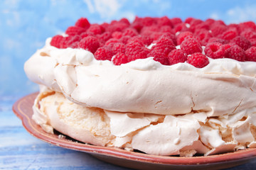 pavlova cake with raspberries and whipped cream