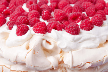 pavlova cake with raspberries and whipped cream