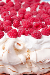 pavlova cake with raspberries and whipped cream