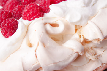 pavlova cake with raspberries and whipped cream