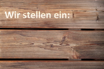Wir stellen ein - Text auf rustikalem Holz mit Platz zum selbst Beschriften