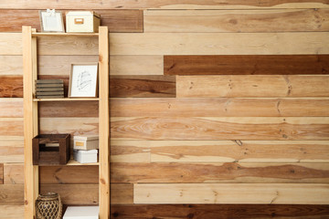 Modern shelf unit near wooden wall