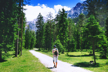 Family spend summer holiday in Dolomites, South Tyrol, Italy, Europe.