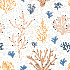 Seamless pattern with orange and blue corals, seaweed and bubbles on white background © Good Studio
