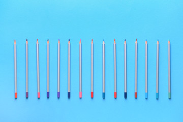 Many pencils on color background