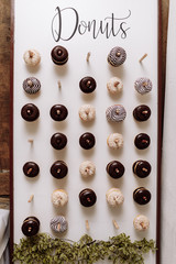wedding chocolate donuts for guests. festive concept. sweets on a wedding day. wedding donuts