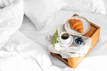 Tasty healthy breakfast on bed