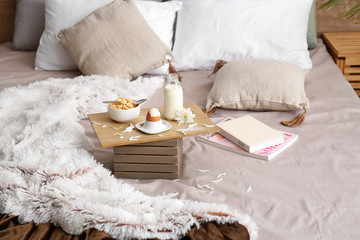 Tasty healthy breakfast on bed