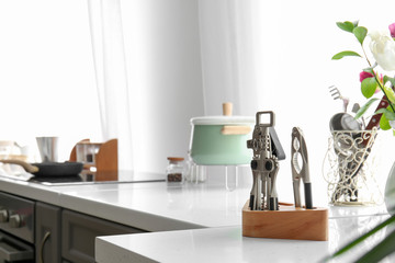 Set of clean utensils on counter in kitchen