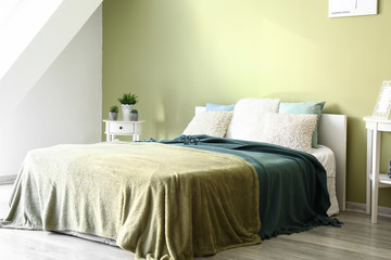 Fototapeta na wymiar Big soft bed in interior of room
